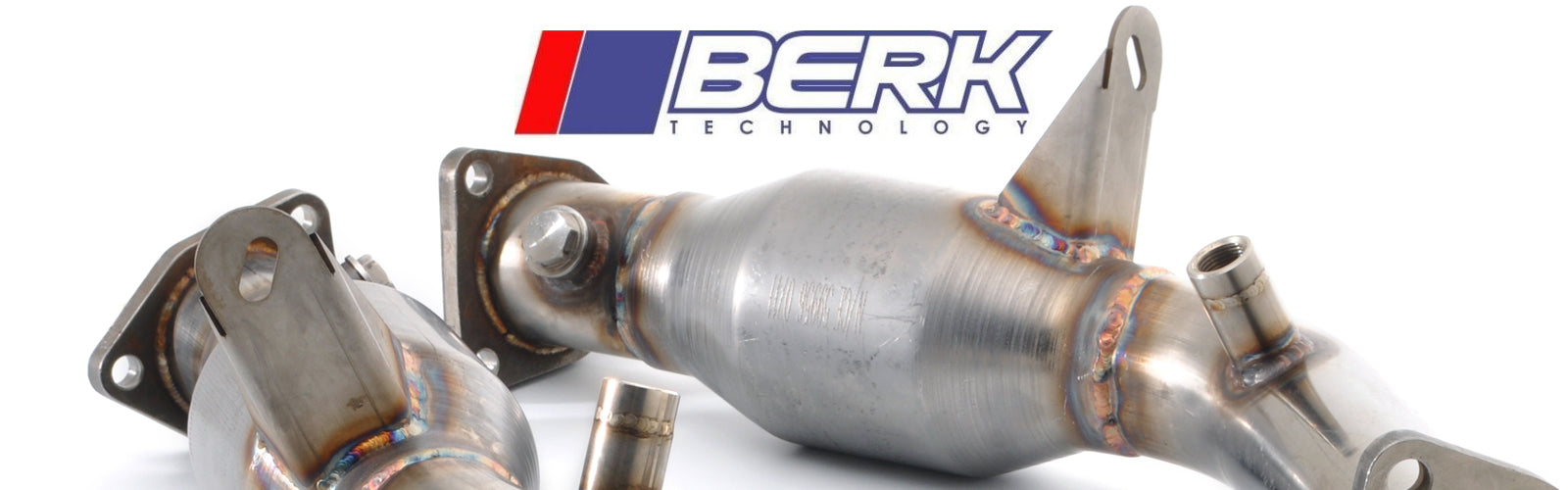 Metallic exhaust components with BERK Technology logo in the background