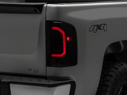 Raxiom 07-14 Chevrolet Silverado 1500 Axial Series LED Tail Lights- Black Housing (Smoked Lens)