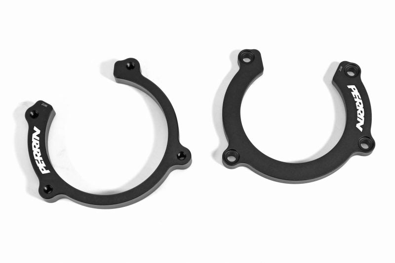 Perrin Driveshaft Lockdown components in black, designed to secure driveshafts for enhanced vehicle performance.