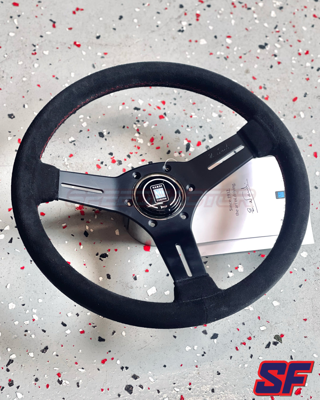 Nardi Competition 330mm Black Spokes / Black Suede / Red Stitch