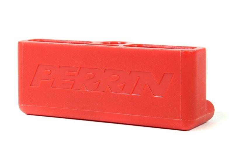 Red Perrin trunk handle designed for easy grip and access, featuring a durable rubber construction.